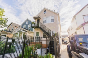 Welcome to this spacious two family home in the heart of South Ozone Park, Queens, Renovated Complete in 2007.