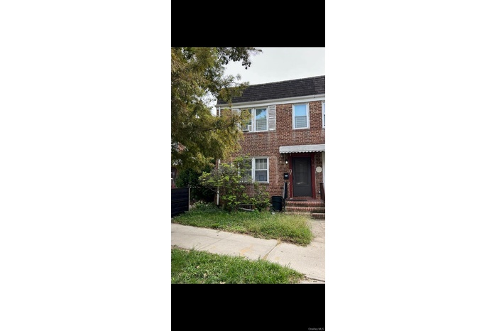 View of front facade featuring brick siding