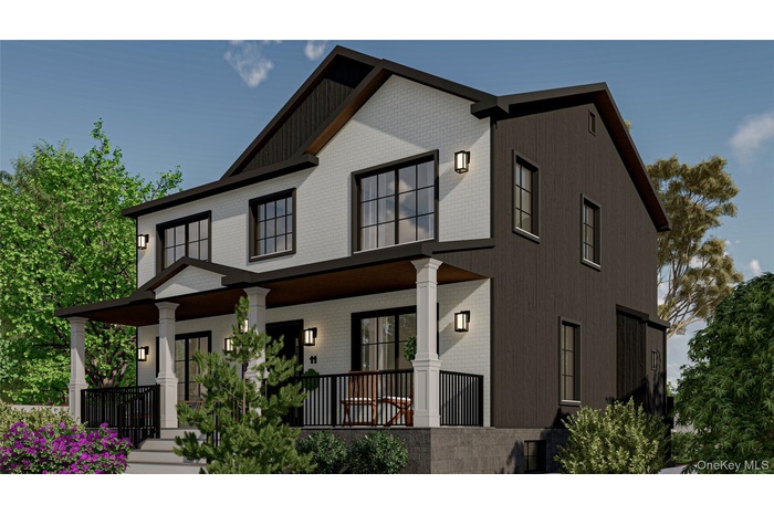 View of front facade featuring brick siding and covered porch