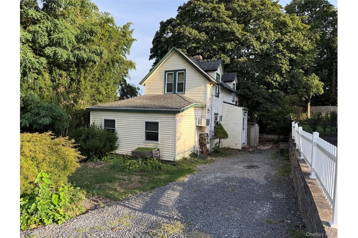 View of property exterior featuring a shingled roof