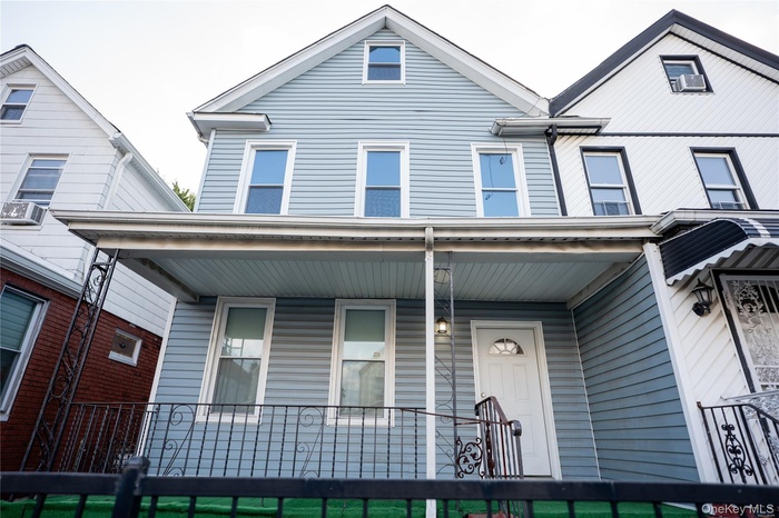 View of front of property with a porch