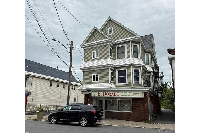 View of front of house with brick siding