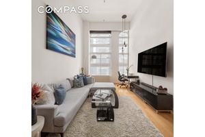 Welcome to Unit 309 at 67 East 11th Street a stunningly renovated one bedroom loft with southern exposure and 16 ft ceilings, once prominently featured in Dwell Magazine.