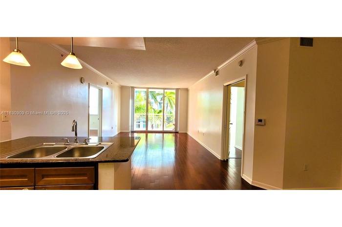 Enter your new property and see the tropical palm trees!