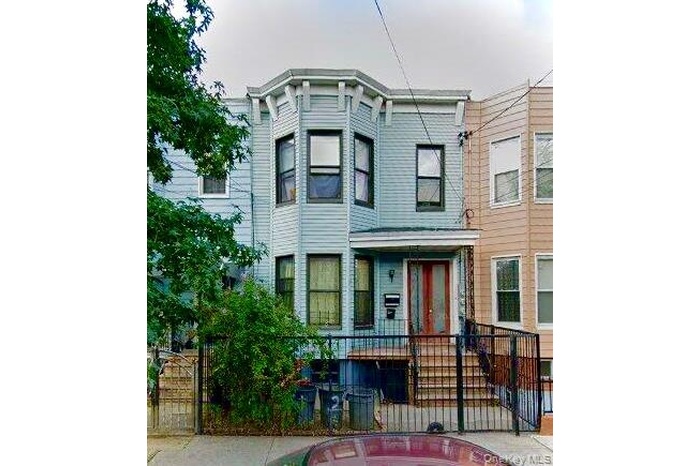 View of front facade featuring fence