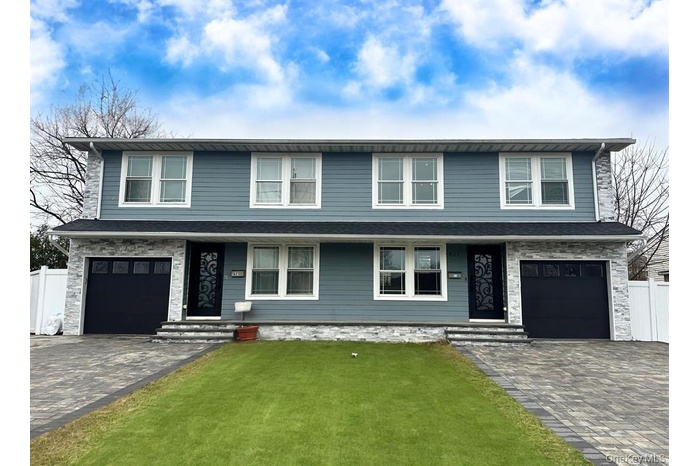 Duplex Unit#821- right side with a garage and paved driveway