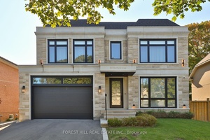Welcome to an extraordinary residence that blends timeless elegance with modern functionality, situated on an expansive 60 foot wide lot.