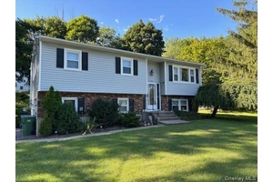 Welcome to this spacious and versatile 4 bedroom, 2 full bath high ranch, ideally situated on a level lot in the scenic Hudson Valley.