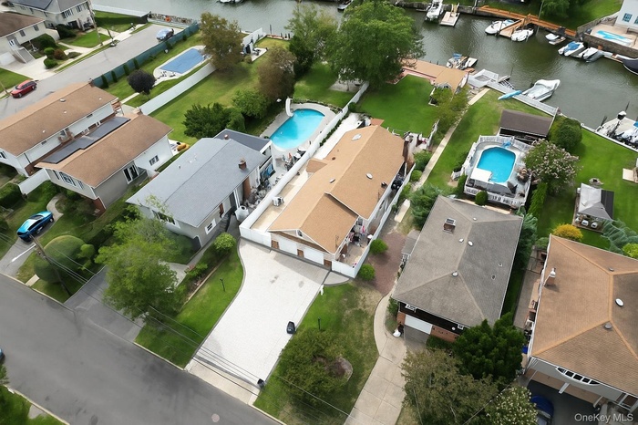 View of property location with nearby suburban area and a large body of water