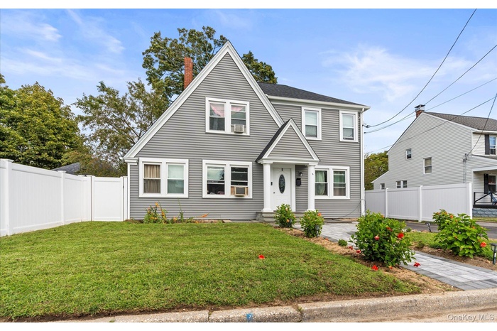 View of front of house featuring a chimney
