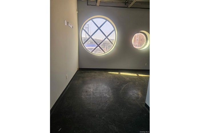 Empty room featuring baseboards