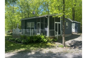 Discover this unique custom built resort cottage, perfectly positioned on a spacious private site overlooking serene green space.