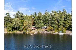 Exceptional Multi Cottage, Commercially Zoned Property on the Moon River in the Heart of Bala !