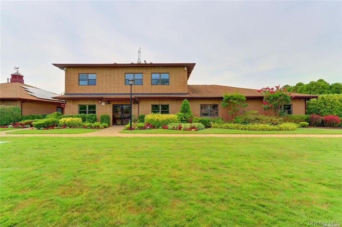 View of front of house with a front yard