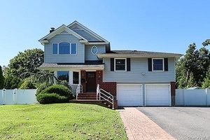 Set on a quiet, tree lined street, this four bedroom, three bath home offers modern style and comfortable living.