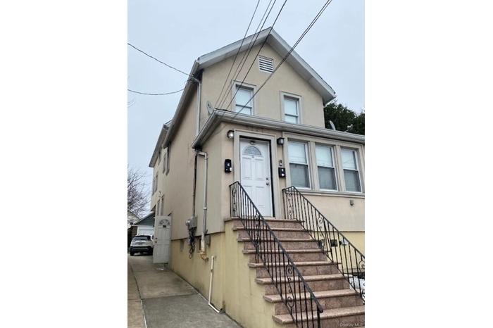 View of front of house with stucco siding