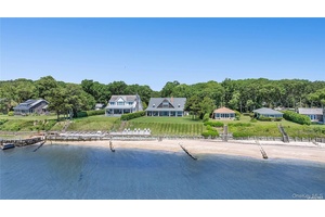 Welcome to a unique luxury waterfront estate, perfectly situated overlooking the Peconic Bay, with stunning views of Robin's Island and the Hamptons.