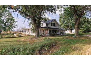 Experience the tranquility of country living in this spacious 5 bedroom home set on an expansive 5.