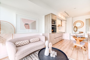 Modern, high floor 1 bedroom den condo with two full bathrooms featuring separate showers.
