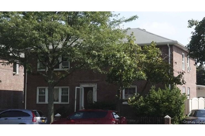 View of front facade featuring brick siding