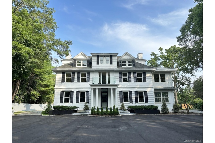 View of front of house featuring a chimney