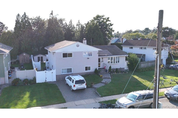 View of front facade featuring a gate and a residential view