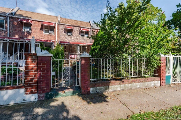 Gate with a fenced front yard