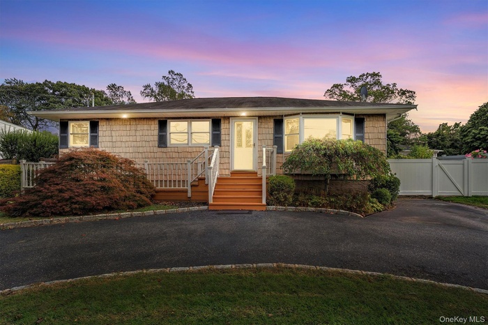 View of front of home featuring at twilight look