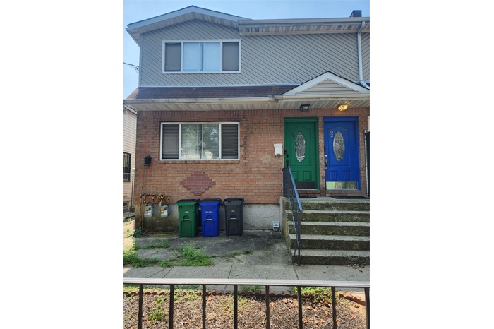 View of front of house featuring brick siding