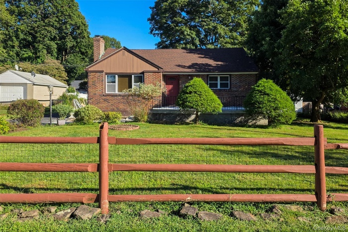 View of front of home with brick siding.