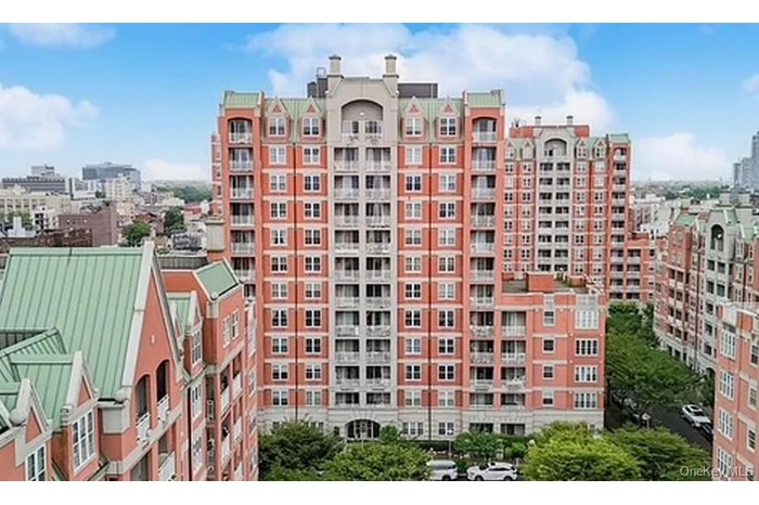 View of apartment building / complex with a city view