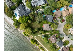 Unobstructed Lake Ontario views define this rare opportunity in South East Oakville's prestigious Arkendo enclave.