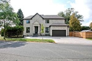 Contemporary Sun Filled Custom Built Home Located Strategically On A Prime Corner.