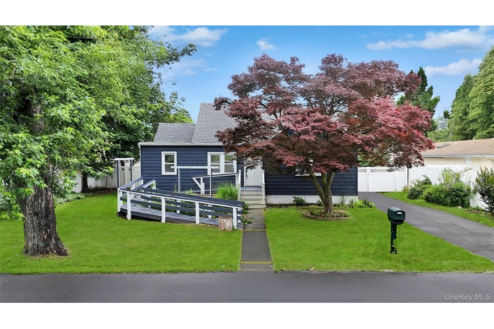 View of front of house featuring roof with shingles