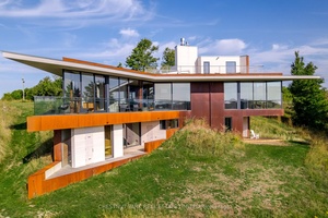 The Brillinger House. Architecture and nature harmonize in a magical setting with this stunning 2024 build, designed by Adam Thom.