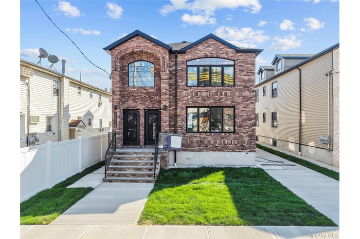 View of front of home with brick siding