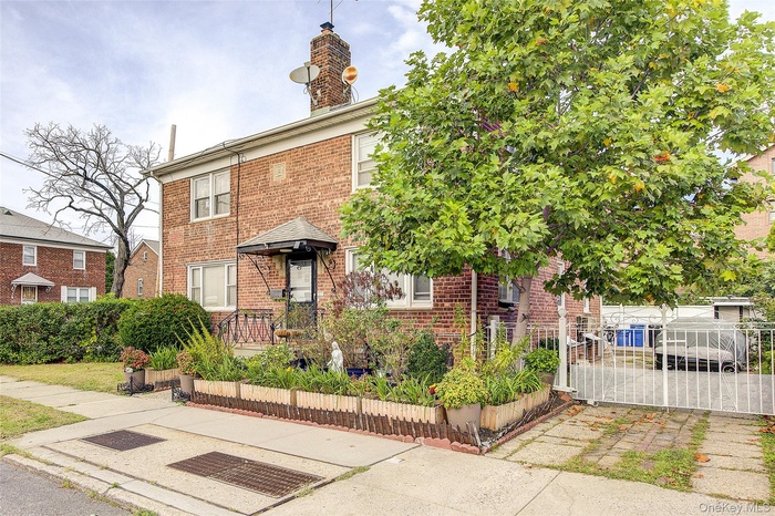 Traditional home featuring brick siding