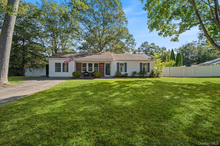 View of front of home with brick siding and driveway