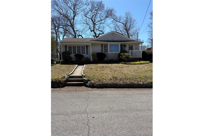 View of front of house with a front yard