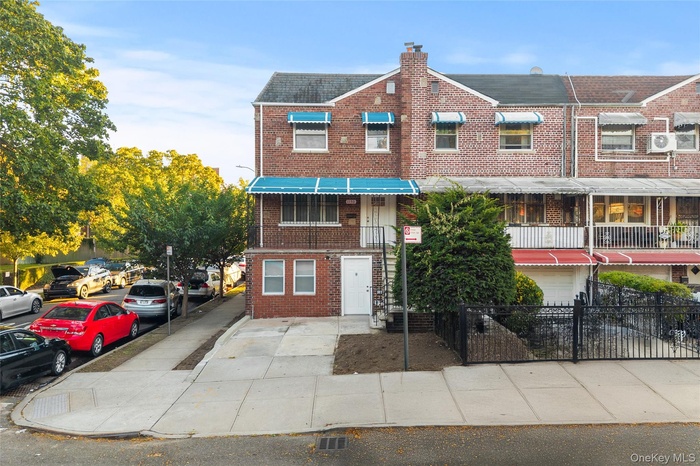 Traditional-style house featuring brick siding and a chimney