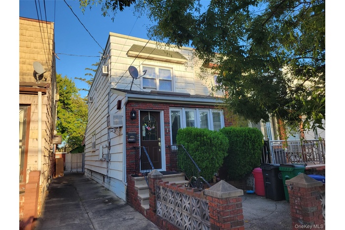 View of front of house featuring brick siding