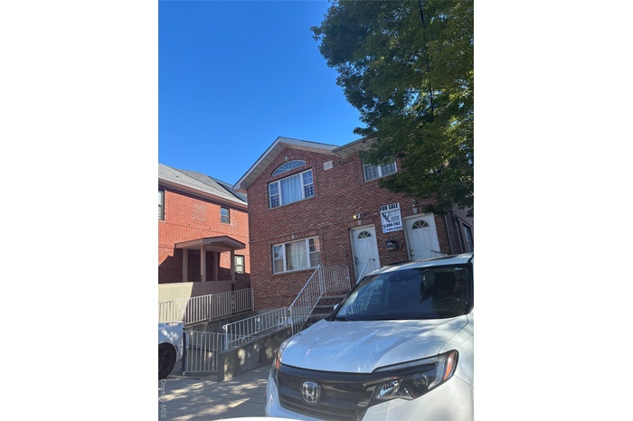 View of front of house featuring brick siding