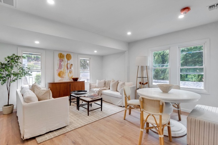 Living room featuring light wood-type flooring and recessed lighting