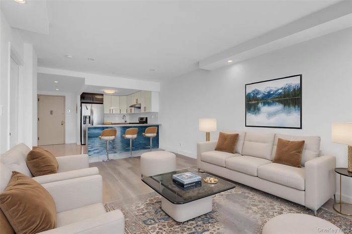 Living area featuring recessed lighting and light wood-style floors