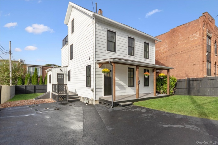 Front of house with porch and driveway