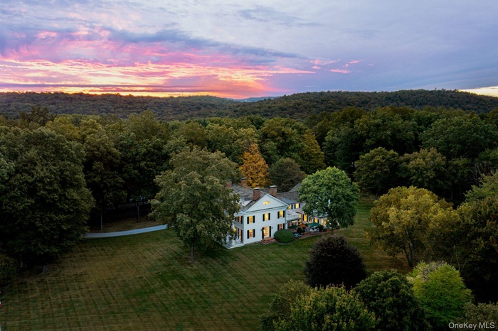 Aerial view at dusk of a wooded view