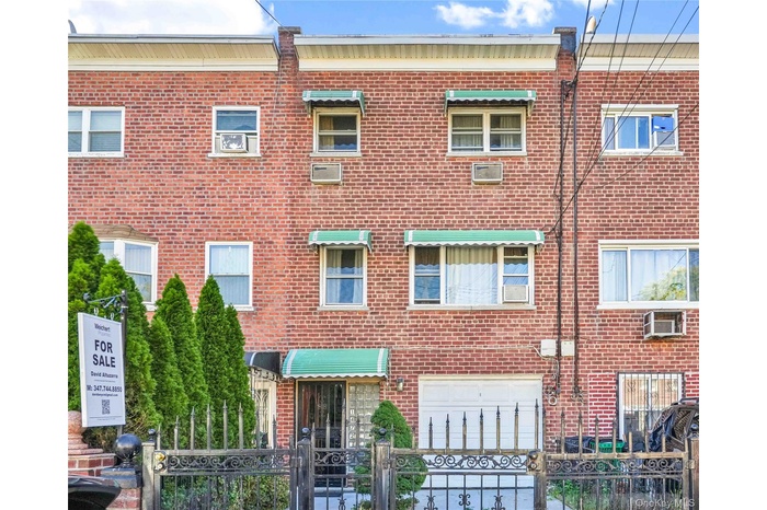 View of property with a fenced front yard