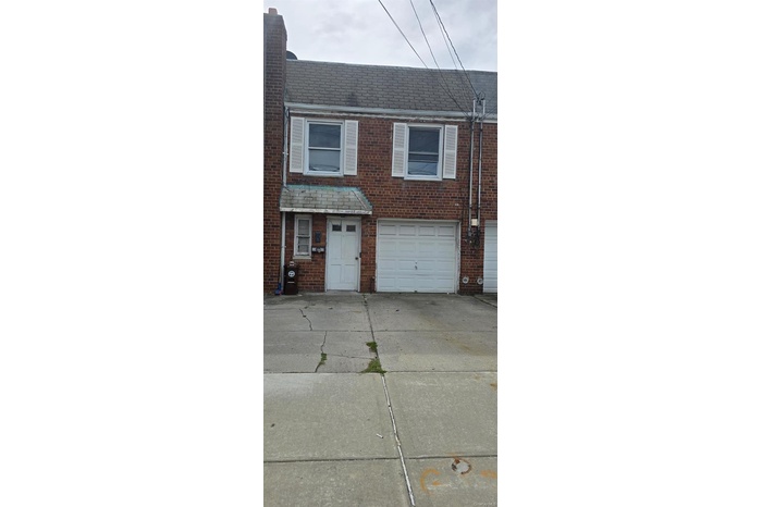 View of front of home with brick siding