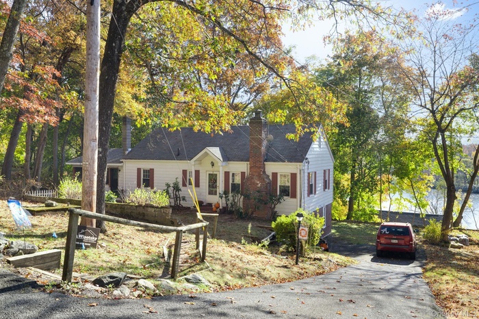 Home with ample driveway parking and water views