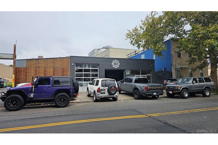 View of property with uncovered parking